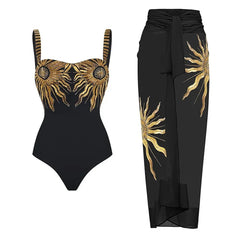 Black one-piece swimsuit with gold sun embroidery and matching black sarong.