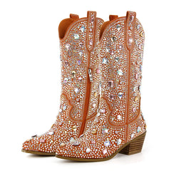 Decorative cowboy boots with rhinestones on a white background