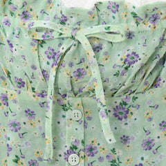 Floral patterned fabric with a green background
