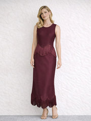 Burgundy sleeveless O-neck maxi dress with fringe trim at the waist and hem.