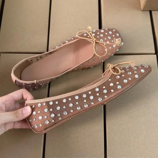 Crystal embellished mesh ballet flats in beige with a bow detail.