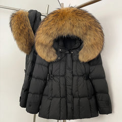 Black puffer jacket with a large fur hood on a rack 