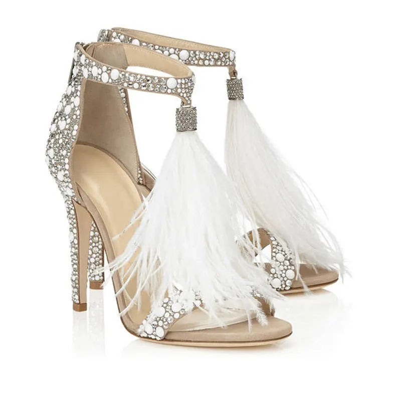 Feather embellished stiletto heels with rhinestone and pearl details.