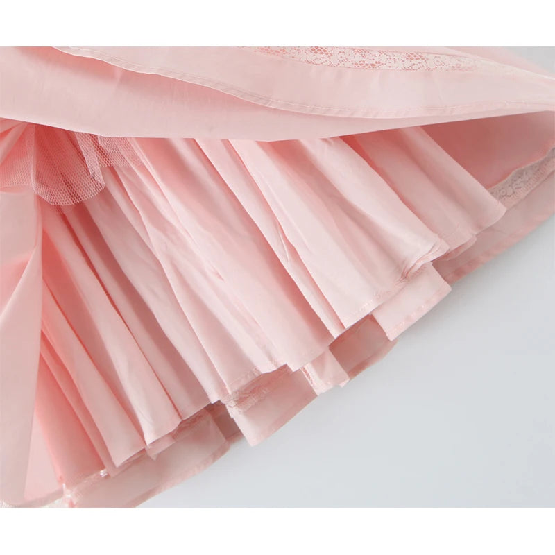 Close-up of a pink tulle skirt on a light gray background
