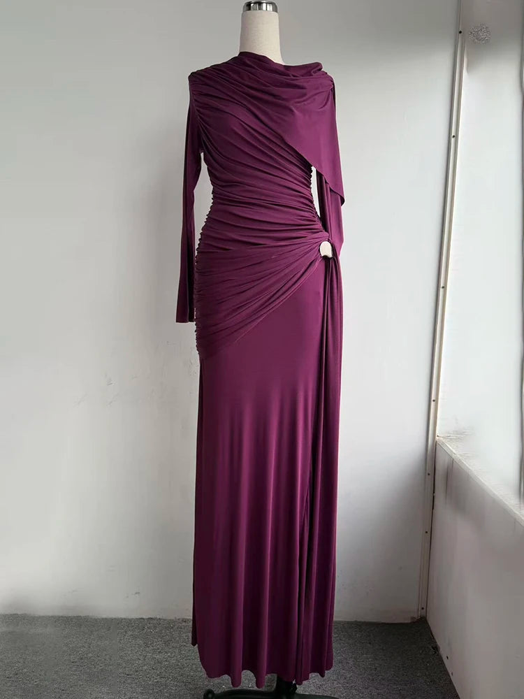 Purple evening gown on a mannequin against a plain background
