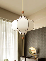 Decorative pendant light hanging in a room with patterned wallpaper and a mirror.