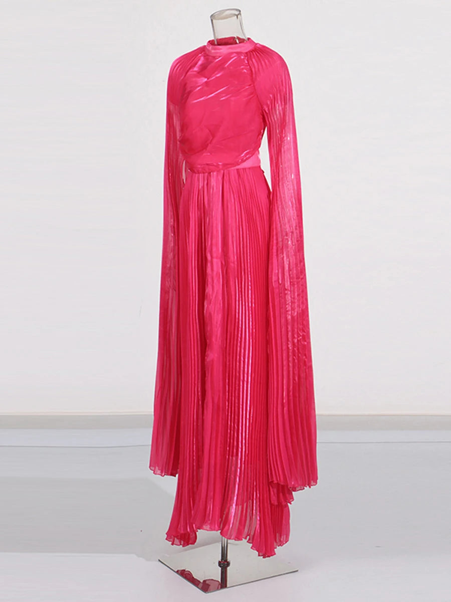 Pink pleated dress on a mannequin against a white background