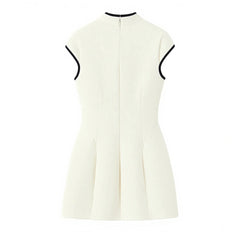 White sleeveless dress with black trim on a white background