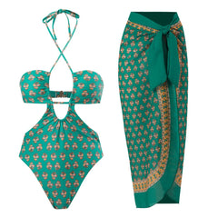 Green floral printed one-piece swimsuit and matching sarong skirt.