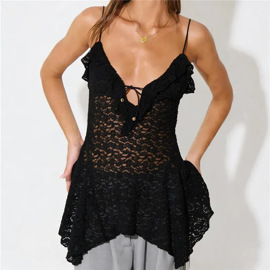 Black lace top worn by a person on a plain background