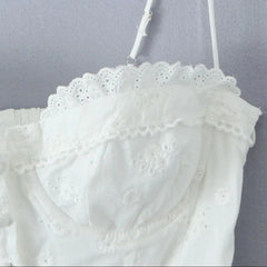 White lace top on a gray background