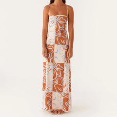 Woman wearing a floral patterned dress on a white background
