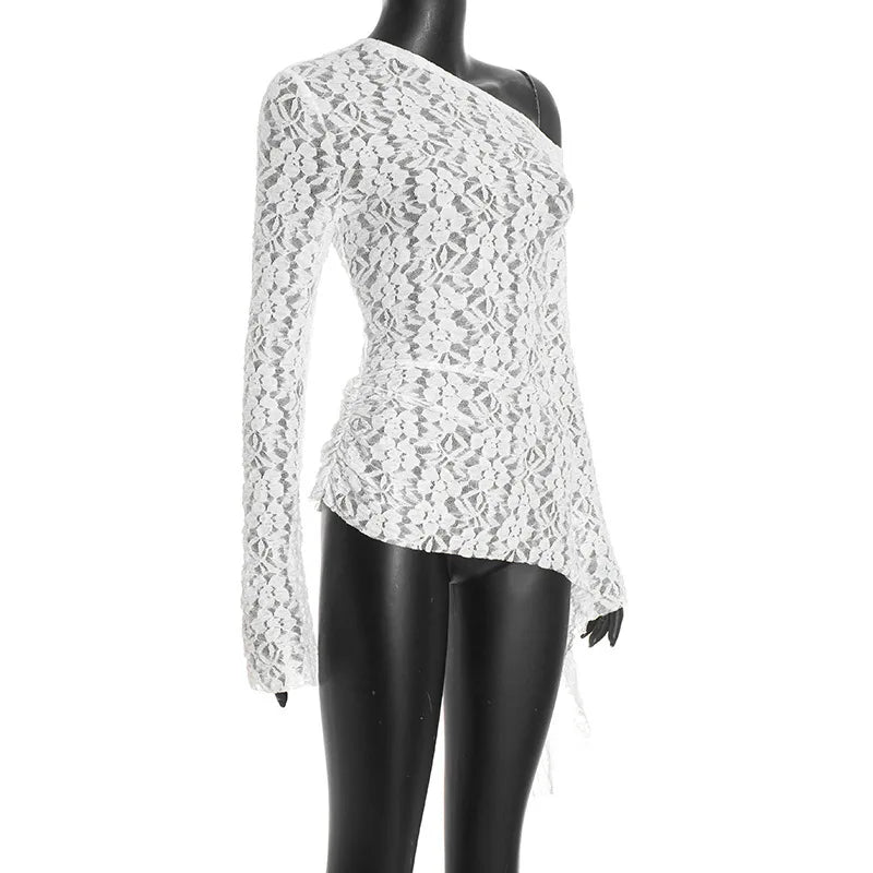 White lace top on a mannequin against a white background