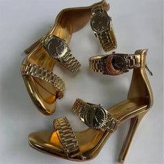 Pair of gold metal watch strap dress heels