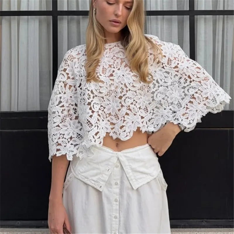 White cropped lace top with batwing sleeves.