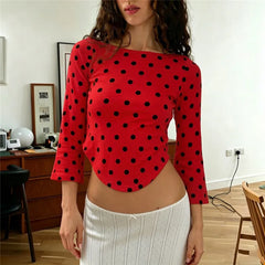 Red polka dot boat neck 3/4 sleeve crop top with curved hem