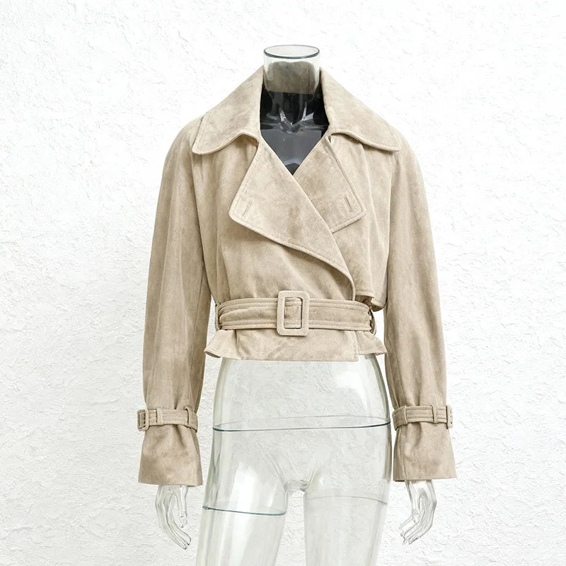 Beige trench coat on a mannequin against a white background