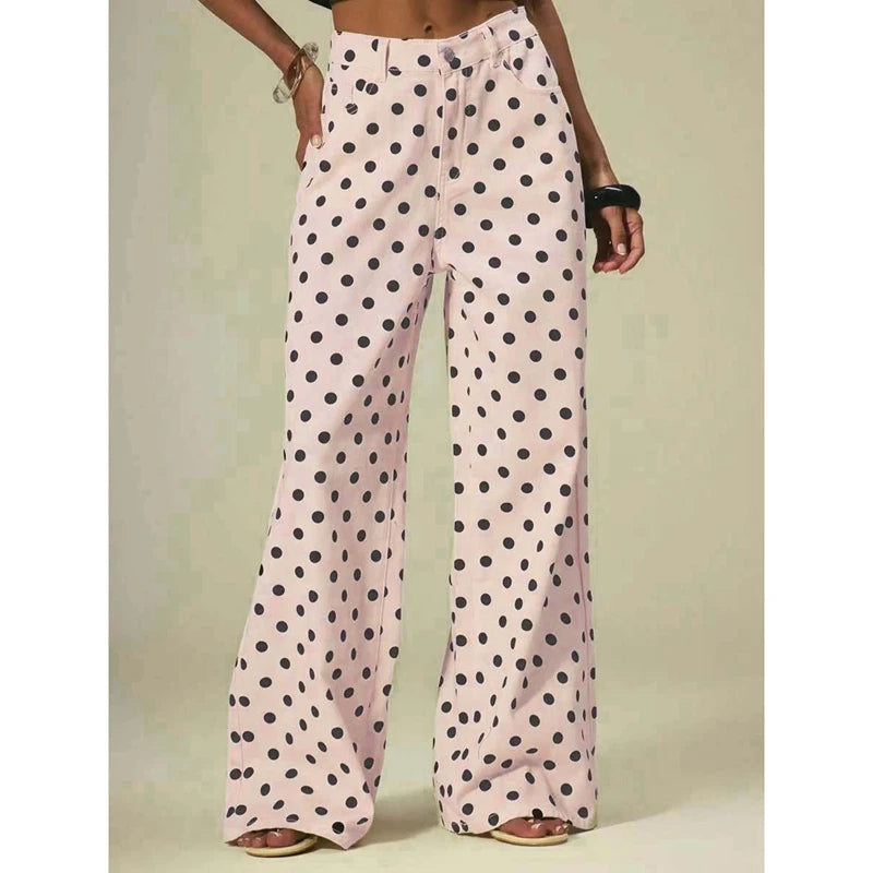Polka dot pants worn by a person on a plain background