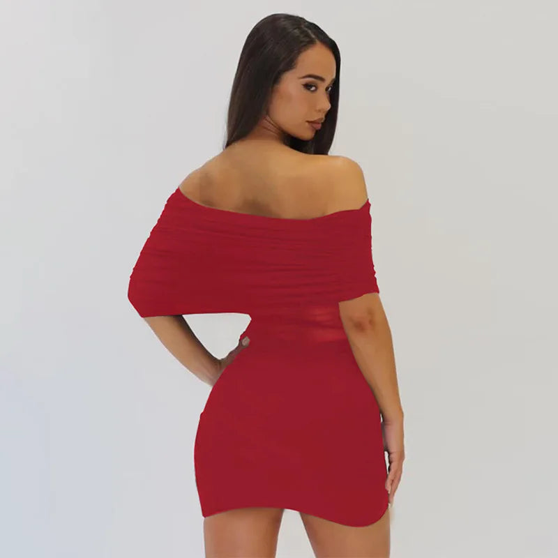 Woman wearing a red off-shoulder dress against a plain background