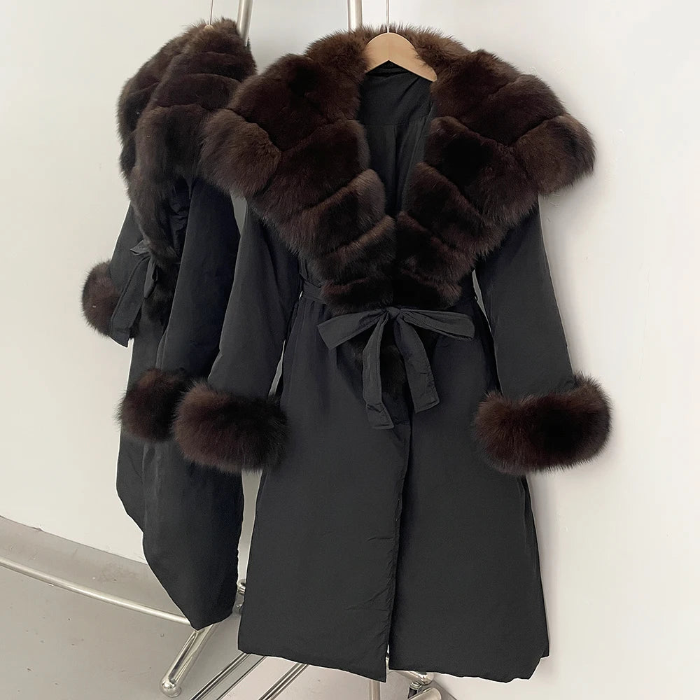Black coat with brown fur trim on a rack 