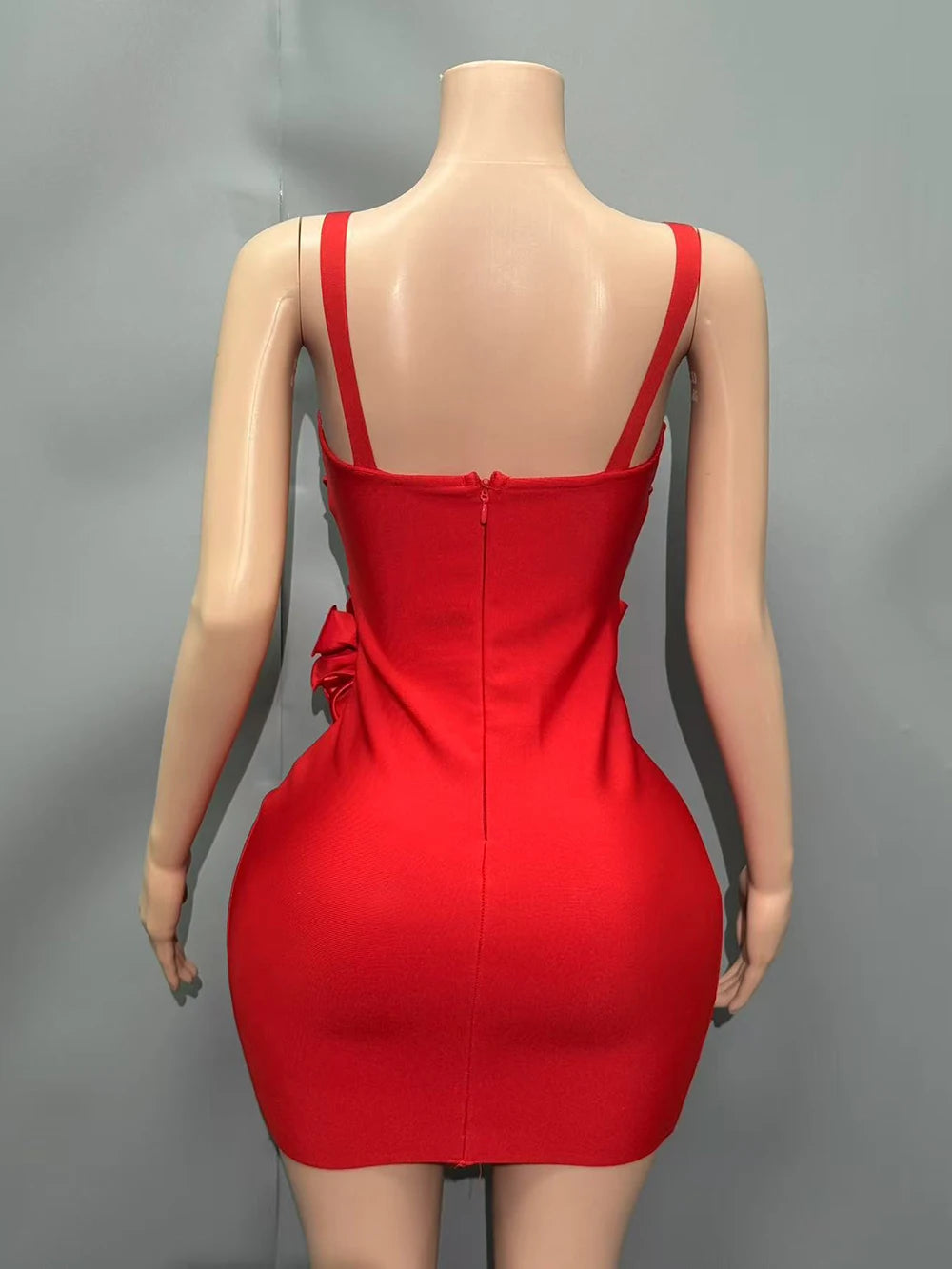 Red dress on a mannequin against a gray background