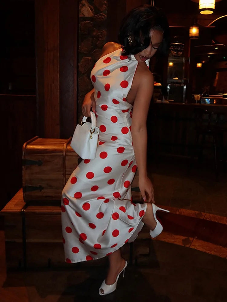 Detail of a polka dot halter neck maxi dress