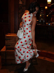 Detail of a polka dot halter neck maxi dress
