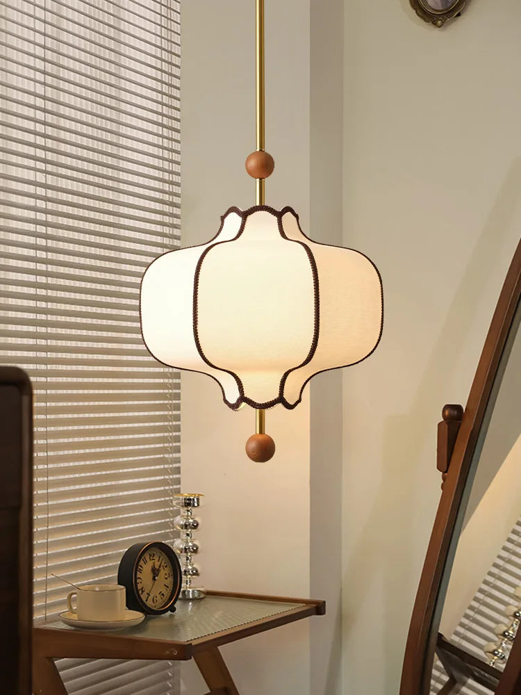 Beige and white cloth lantern pendant light with LED bulb and polished chrome finish, ideal for modern bedrooms and lounge interiors