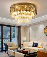Chandelier in a living room with a couch and window view