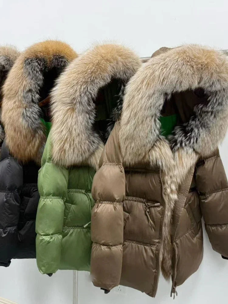 Row of puffer jackets with fur hoods on a white background