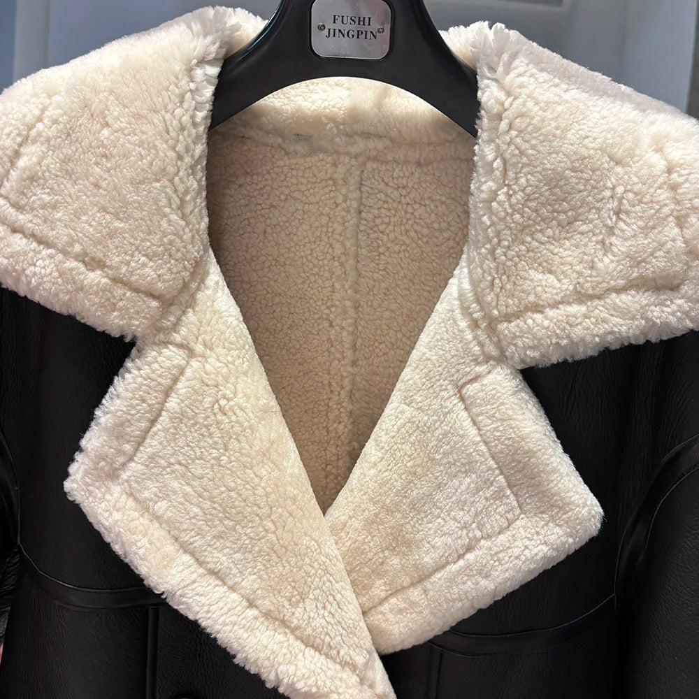 White sherpa-lined jacket on a hanger with a blurred background