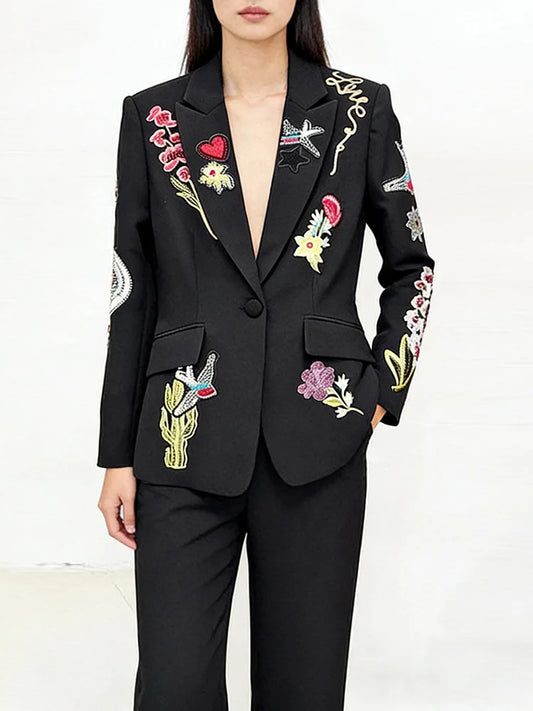 Black blazer and trousers suit with intricate bead embroidery