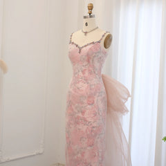 Mannequin displaying the pink velvet mermaid evening gown, showcasing its flattering silhouette and elegant train .Golden Atelier 4