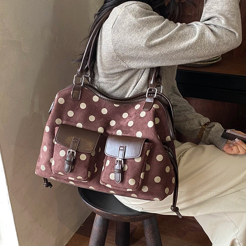Brown polka dot faux leather tote bag with dual front pockets