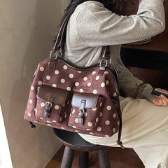 Brown polka dot faux leather tote bag with dual front pockets