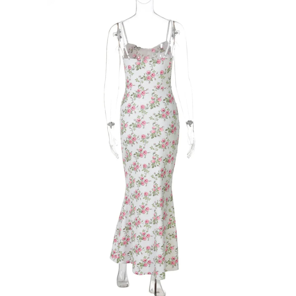 Floral dress on a mannequin against a white background