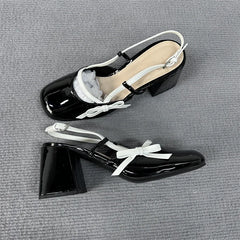 Pair of black patent slingback bow block heels