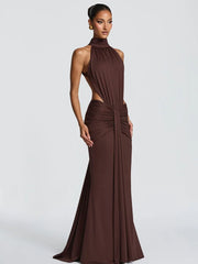 Woman wearing a brown evening gown on a white background