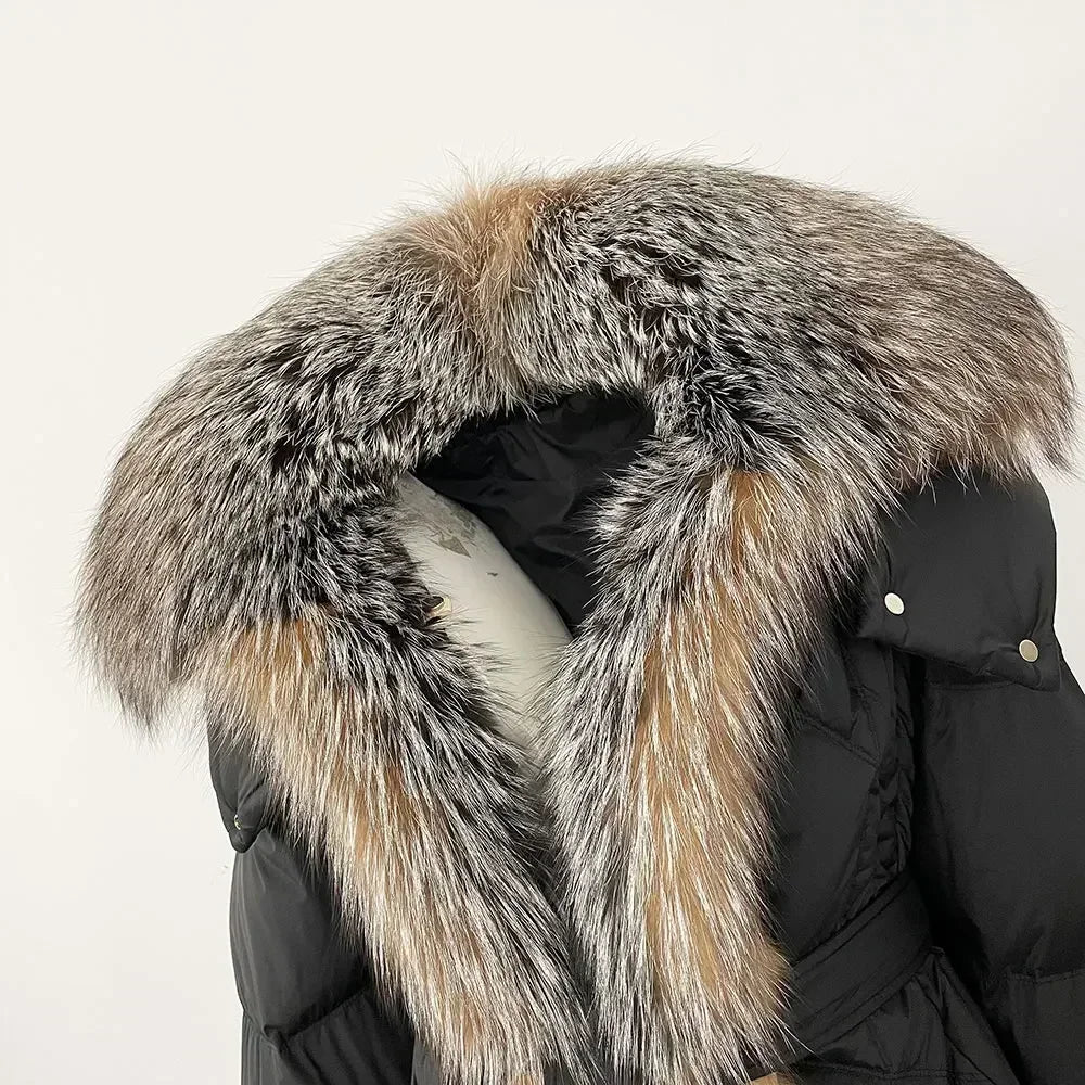 Black winter coat with a fur-lined hood on a light beige background