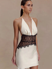 White satin mini dress with lace patchwork at the waist
