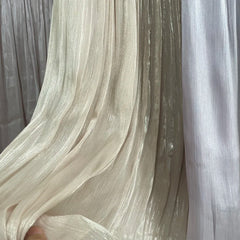 Close-up of sheer fabric with a blurred background