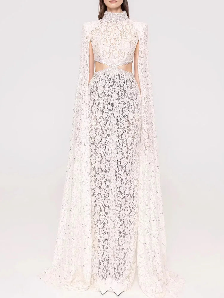 White floral dress with a cape on a white background
