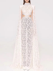 White floral dress with a cape on a white background