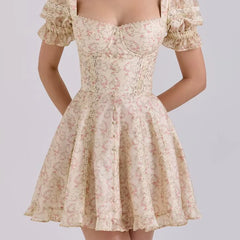 Beige floral dress with lace details on a plain background