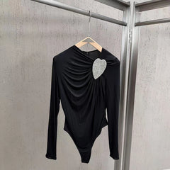 Black asymmetrical long-sleeve bodysuit with heart rhinestone on hanger
