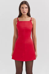 Red dress worn by a model on a white background