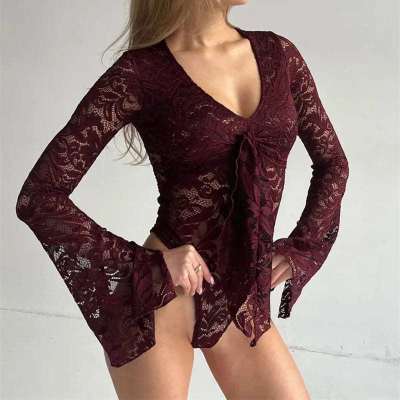 Maroon lace dress worn by a person on a light gray background