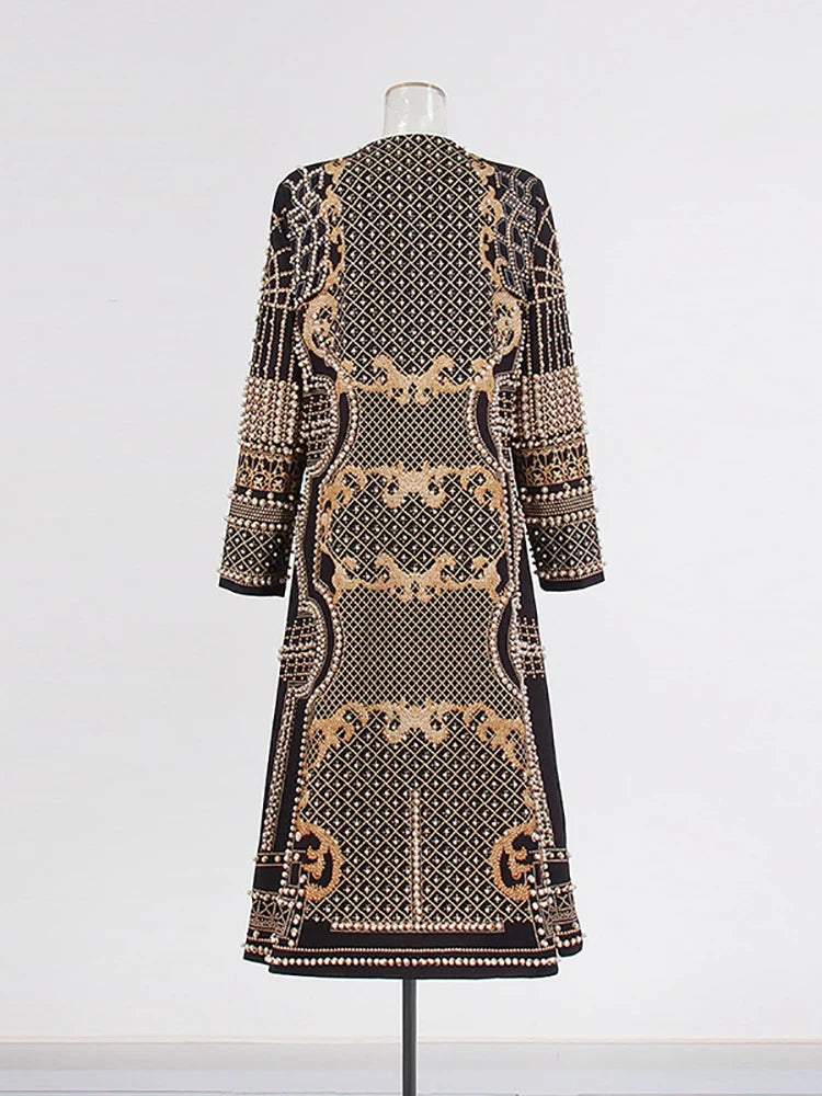 Embellished geometric print coat on mannequin back