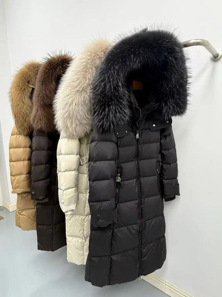Four puffer jackets with fur-lined hoods in different colors hanging on a rack.