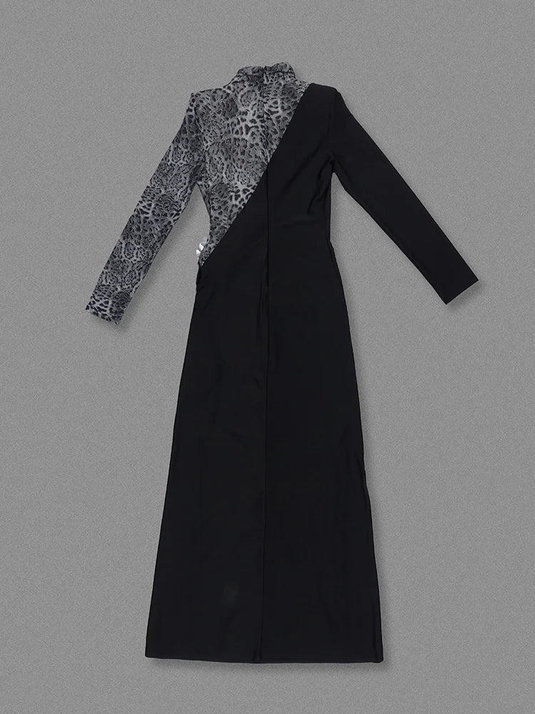 Black dress with patterned long-sleeve top on a gray background